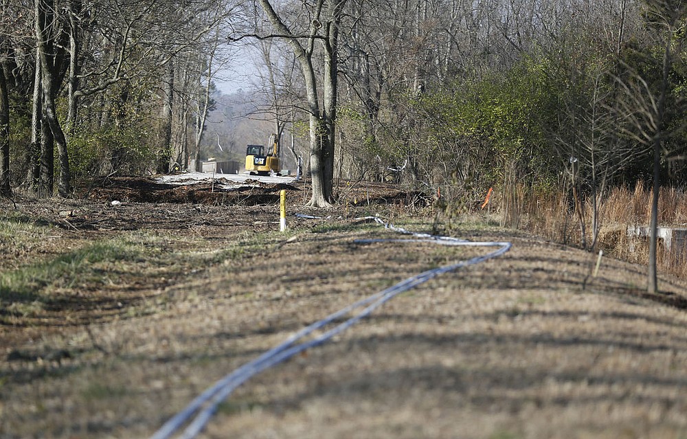 Work continues by the city of Fayetteville Trails Department Friday, Dec. 4, 2020, on the Clabber Creek Trail between Truckers Drive and Holcomb Elementary School in Fayetteville. The city has about 5 miles of new trail construction planned next year using a mix of capital, bond and grant money. Check out nwaonline.com/201206Daily/ and nwadg.com/photos for a photo gallery.
(NWA Democrat-Gazette/David Gottschalk)