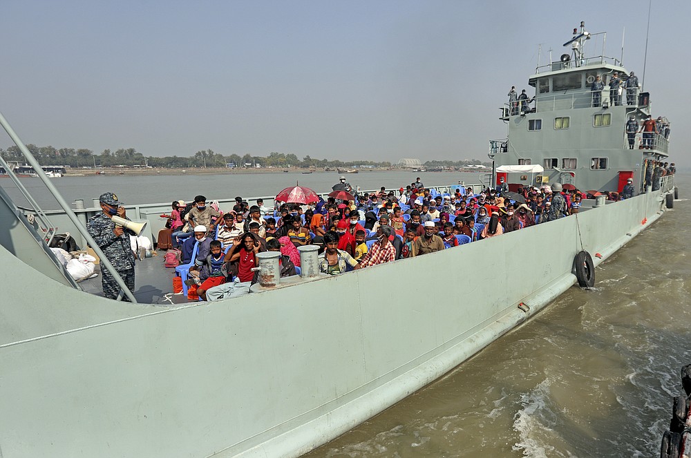Rohingya refugees are transported on a naval vessel to Bhashan Char, or floating island, in the Bay of Bengal, from Chittagong, Bangladesh, Friday, Dec. 4, 2020. Authorities in Bangladesh on Friday started sending a first group of nearly more than 1,500 Rohingya refugees to an isolated island despite calls by human rights groups for a halt to the process. (AP Photo).