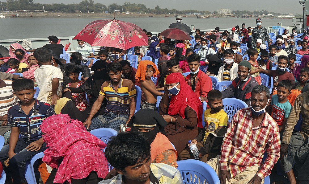 Rohingya refugees are transported on a naval vessel to Bhashan Char, or floating island, in the Bay of Bengal, from Chittagong, Bangladesh, Friday, Dec. 4, 2020. Authorities in Bangladesh on Friday started sending a first group of nearly more than 1,500 Rohingya refugees to an isolated island despite calls by human rights groups for a halt to the process. (AP Photo).