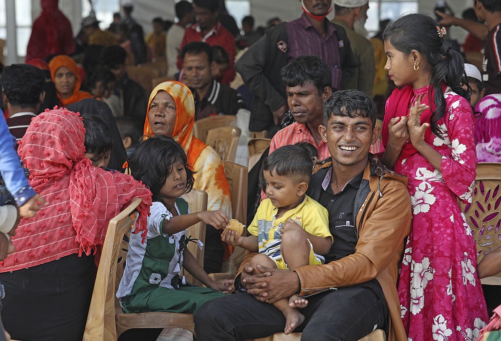 Rohingya refugees wait to be transported on a naval vessel to Bhashan Char, or floating island, in the Bay of Bengal, from Chittagong, Bangladesh, Friday, Dec. 4, 2020. Authorities in Bangladesh on Friday started sending a first group of nearly more than 1,500 Rohingya refugees to an isolated island despite calls by human rights groups for a halt to the process. (AP Photo).