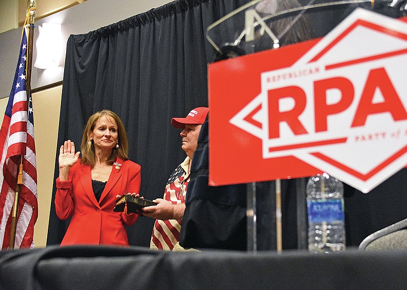 Jonelle Fulmer of Fort Smith is sworn in as the new chairwoman of the Republican Party of Arkansas on Saturday, Dec. 2020 with her husband Dane Fulmer at the Benton Event Center. See more photos at arkansasonline.com/126rpa/.
(Arkansas Democrat-Gazette/Staci Vandagriff)