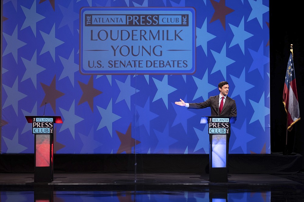 Democratic challenger Jon Ossoff speaks during a debate for U.S. Senate on Sunday, Dec. 6, 2020, in Atlanta. Sen. David Perdue declined to attend the debate. (AP Photo/Ben Gray, Pool)