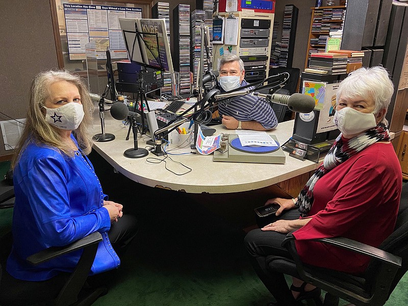 From left, U.S.D. 1812 state President Kay Tatum, Tracy Simpson of KVRE radio station and Sheila Beatty, U.S.D. national veterans chairwoman, discuss the coat drive. (Special to The Commercial)