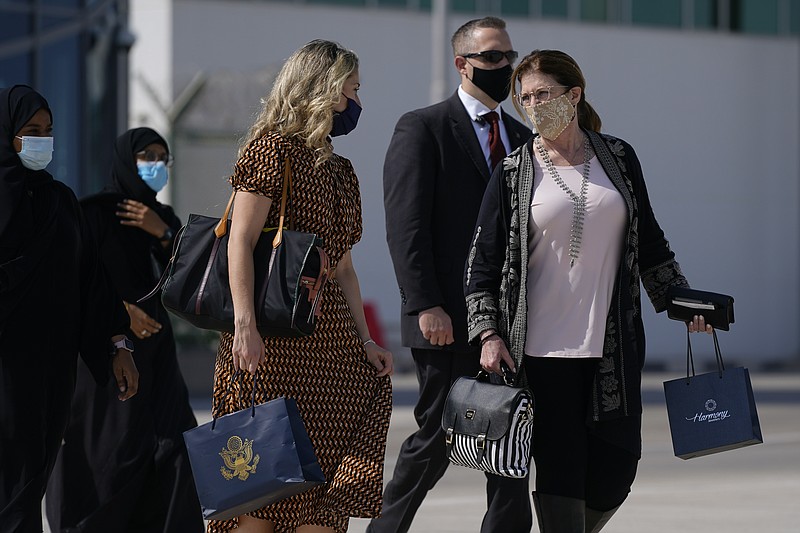 Susan Pompeo, right, boards a plane ahead of her husband, Secretary of State Mike Pompeo, at Al Bateen Executive Airport in Abu Dhabi, United Arab Emirates, on Nov. 21. - AP Photo/Patrick Semansky, Pool