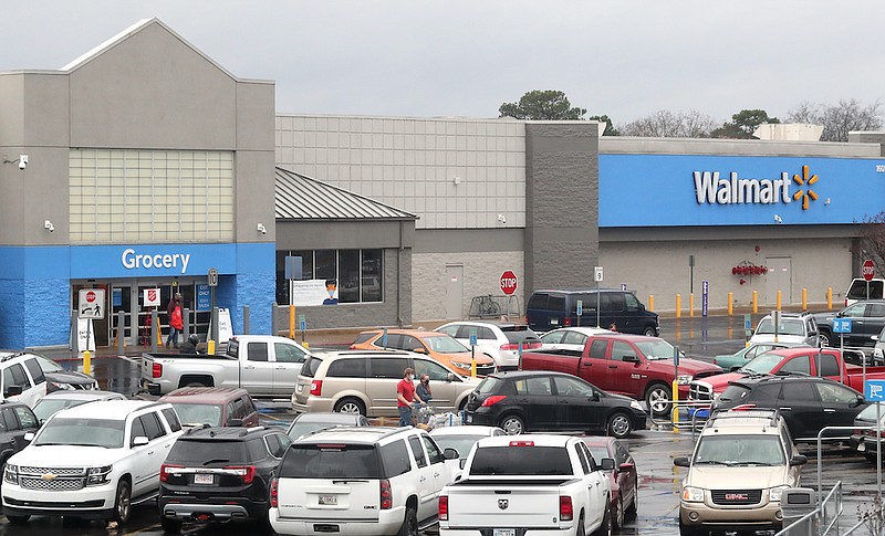 Customers shop at the Albert Pike Road Walmart on Friday. - Photo by Richard Rasmussen of The Sentinel-Record