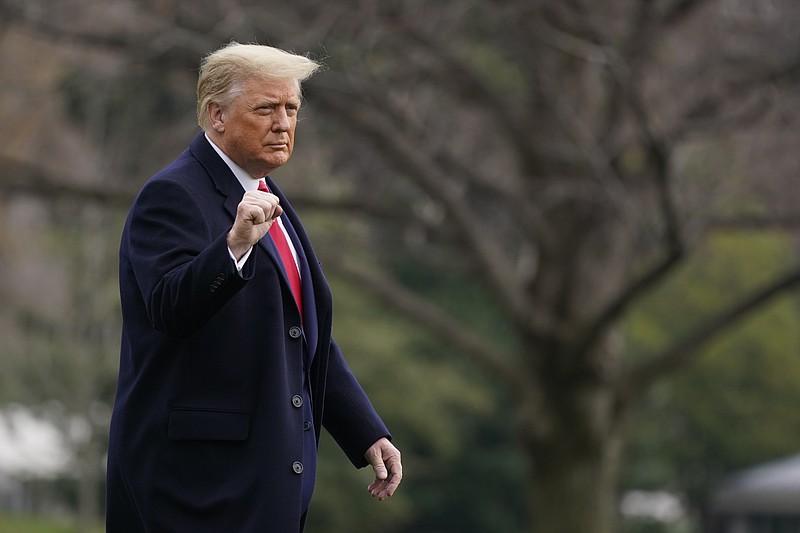 President Donald Trump gestures as he walks on the South Lawn of the White House in Washington, Saturday, Dec. 12, 2020, before boarding Marine One. (AP Photo/Patrick Semansky)