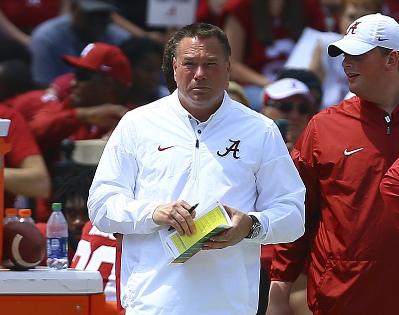 Former Tennessee coach Butch Jones, now an analyst for Alabama, watches from the sidelines during the first half of the Crimson Tide's spring football game in Tuscaloosa, Ala. Jones was named the new head coach for the Arkansas State Red Wolves Saturday. - Photo by Butch Dill of The Associated Press