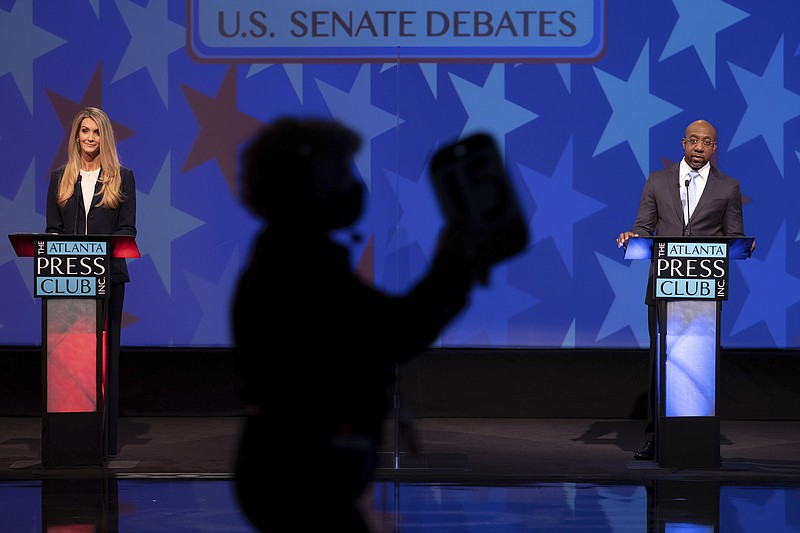 U.S. Sen. Kelly Loeffler, left, and Democratic challenger for U.S. Senate Raphael Warnock appear during a debate, Sunday, Dec. 6, 2020, in Atlanta. (AP Photo/Ben Gray, Pool)