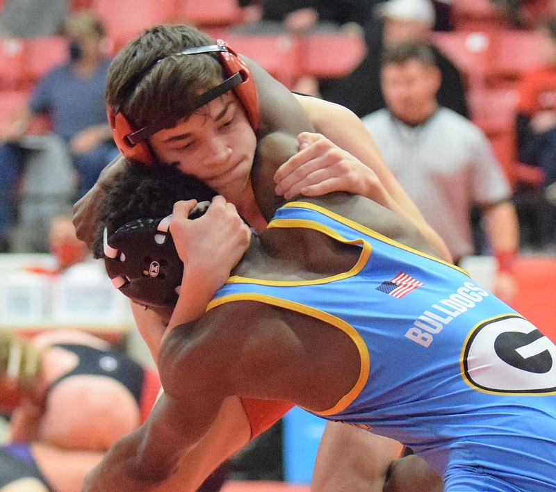 RICK PECK/SPECIAL TO MCDONALD COUNTY PRESS McDonald County 126-pound Aydan Ball is on his way to pinning MarZell Sullivan of Grandview to give the Mustangs’ their lone win of the day at the CJ Classic Wrestling Tournament held on Dec. 12 at Carl Junction High School.