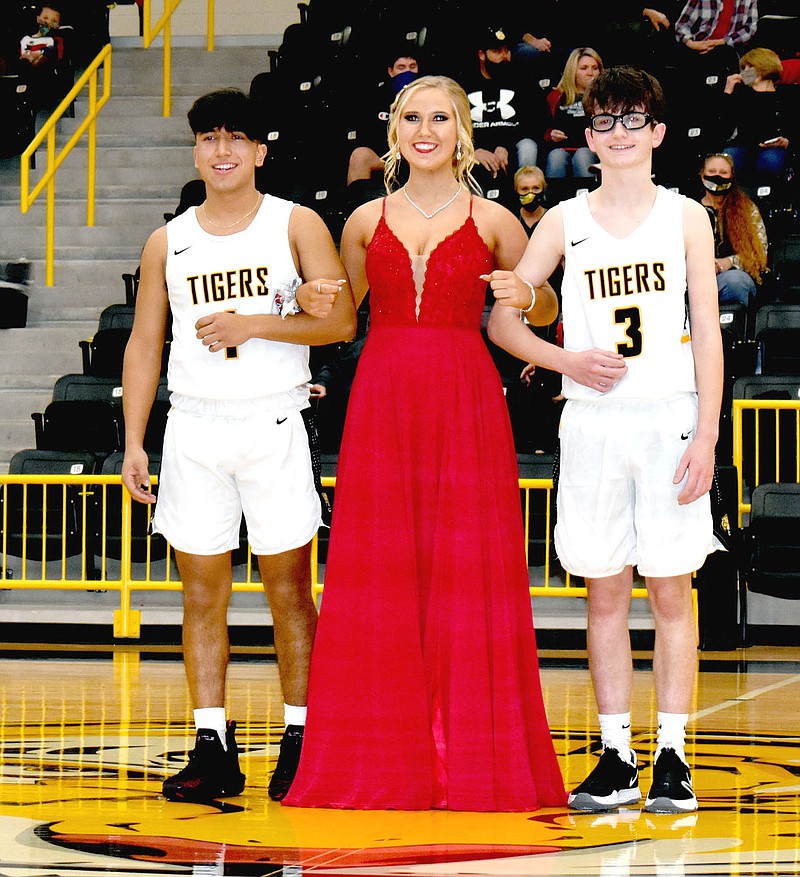 MARK HUMPHREY  ENTERPRISE-LEADER/Prairie Grove freshman maid Emma Henry, daughter of David and Christy Henry, escorted by Marco Martinez (left), son of Marco and Maria Martinez; and Kyzer Wilmer, grandson of Anthony Craig and Anne Burnett.