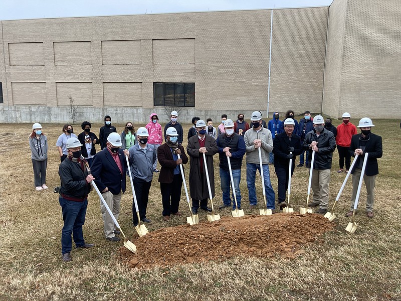 White Hall school officials and others turn the dirt Tuesday morning as the district gets ready to begin work on several projects. (Pine Bluff Commercial/Byron Tate)