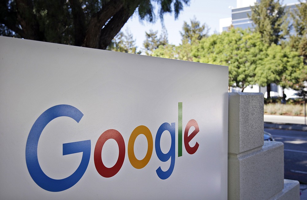 This Oct. 20, 2015, file photo, shows signage outside Google headquarters in Mountain View, Calif. A group of 35 states as well as the District of Columbia and the territories of Guam and Puerto Rico filed an anti-trust lawsuit against Google on Thursday, Dec. 17, 2020, alleging that the search giant has an illegal monopoly over the online search market that hurts consumers and advertisers. The lawsuit, announced by Colorado Attorney General Phil Weiser, was filed in federal court in Washington, D.C. by states represented by bipartisan attorneys general. (AP Photo/Marcio Jose Sanchez, File)