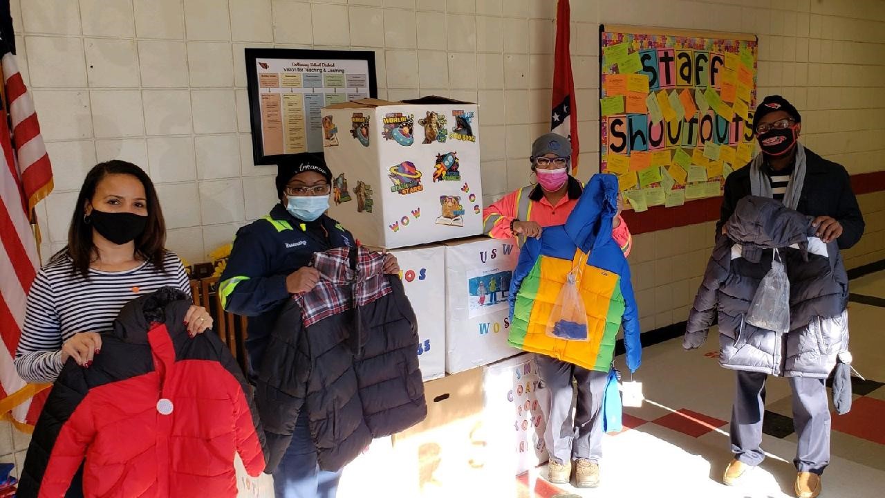 Steel plant workers give coats to pupils