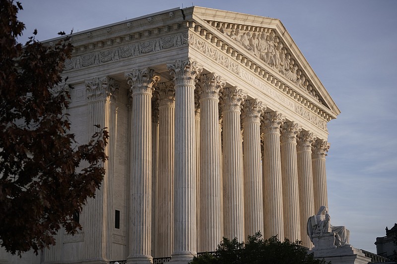 In this Nov. 5, 2020 file photo, The Supreme Court is seen in Washington.  The Supreme Court has dismissed as premature a challenge to President Donald Trump's plan to exclude people living in the country illegally from the population count used to allot states seats in the House of Representatives. But the court’s decision Friday is not a final ruling on the matter and it's not clear whether Trump will receive final numbers from the Census Bureau before he leaves office next month. (AP Photo/J. Scott Applewhite)