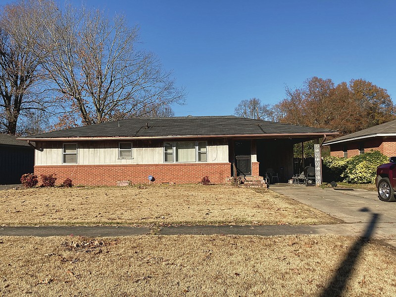 This house, in the 1400 block of West 23rd Avenue, was the scene of an early morning shooting Thursday that left two medics wounded and one man dead. (Pine Bluff Commercial/Byron Tate)