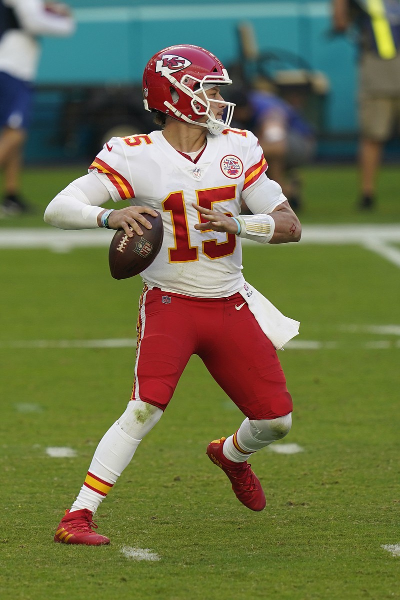 Kansas City Chiefs quarterback Patrick Mahomes (15) looks to pass the football, during the first half of an NFL football game against the Miami Dolphins, Sunday, Dec. 13, 2020, in Miami Gardens, Fla. (AP Photo/Lynne Sladky)