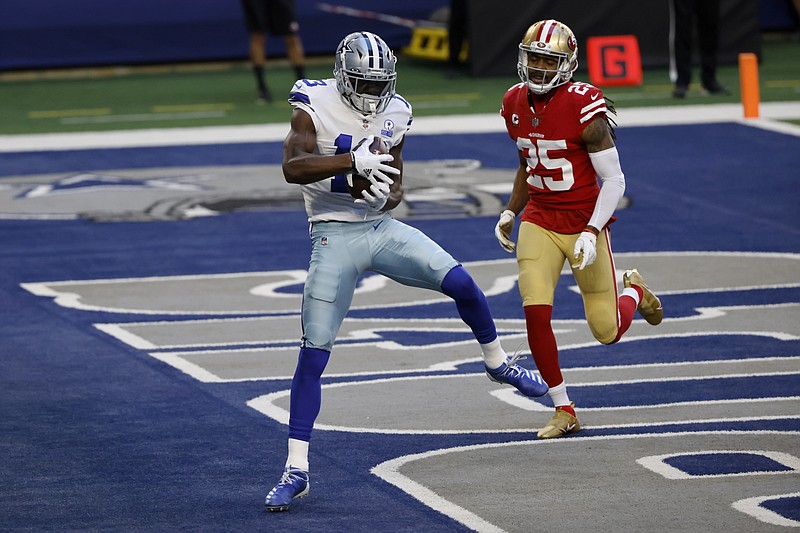 Dallas Cowboys wide receiver Michael Gallup (13) catches a touchdown pass in front of San Francisco 49ers cornerback Richard Sherman (25) in the first half of Sunday's game in Arlington, Texas. - Photo by Ron Jenkins of The Associated Press