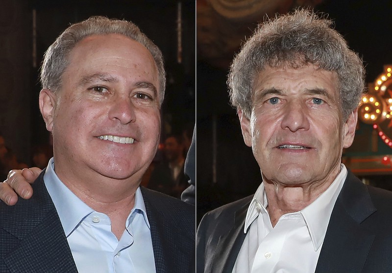 In this combination photo, Alan Bergman, left, and Alan F. Horn, attend the premiere of "The Mandalorian" in Los Angeles on Nov. 13, 2019. The Walt Disney Company announced Monday, Dec. 21, 2020 that  Bergman has been named Chairman, Disney Studios Content, effective January 1, and Horn will continue to serve as the division’s Chief Creative Officer. (Photo by Mark Von Holden/Invision/AP, file)