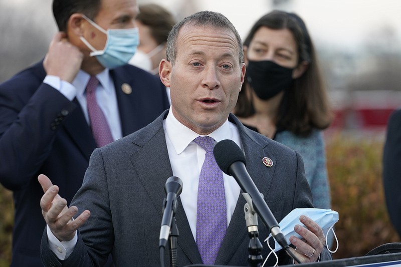 Problem Solvers Caucus co-chair Rep. Josh Gottheimer, D-N.J., speaks to the media with members of his caucus about the expected passage of the emergency COVID-19 relief bill, Monday, Dec. 21, 2020, on Capitol Hill in Washington. Congressional leaders have hashed out a massive, year-end catchall bill that combines $900 billion in COVID-19 aid with a $1.4 trillion spending bill and reams of other unfinished legislation on taxes, energy, education and health care. (AP Photo/Jacquelyn Martin)