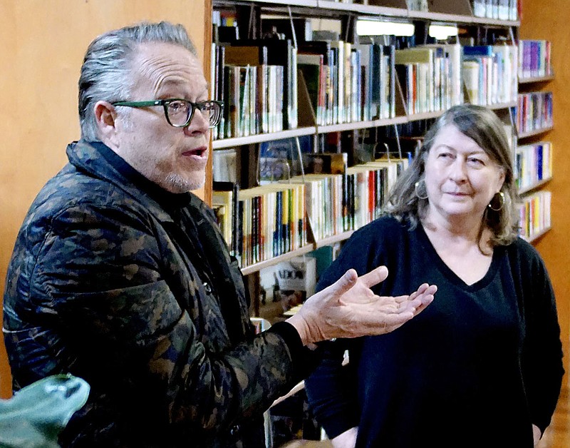 Westside Eagle Observer/RANDY MOLL
Marlon Blackwell, the architect who designed the Gentry Public Library, using the historic Carl Hardware Bulding in Gentry, speaks with Linda Crume, Gentry's librarian, and others about the library's uses and possible changes to the library's floorplan during a visit to the library on Saturday afternoon.