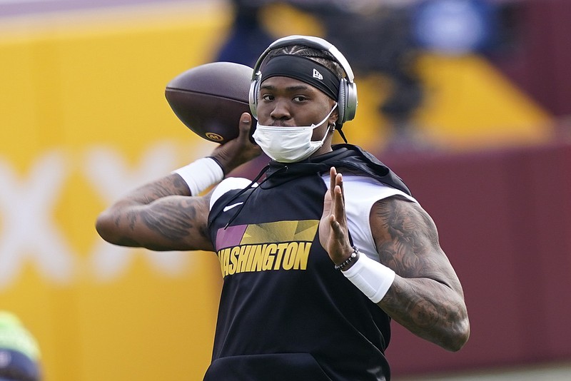 Washington Football Team quarterback Dwayne Haskins warming up before the start of an NFL football game against the Seattle Seahawks, Sunday, Dec. 20, 2020, in Landover, Md. (AP Photo/Susan Walsh)
