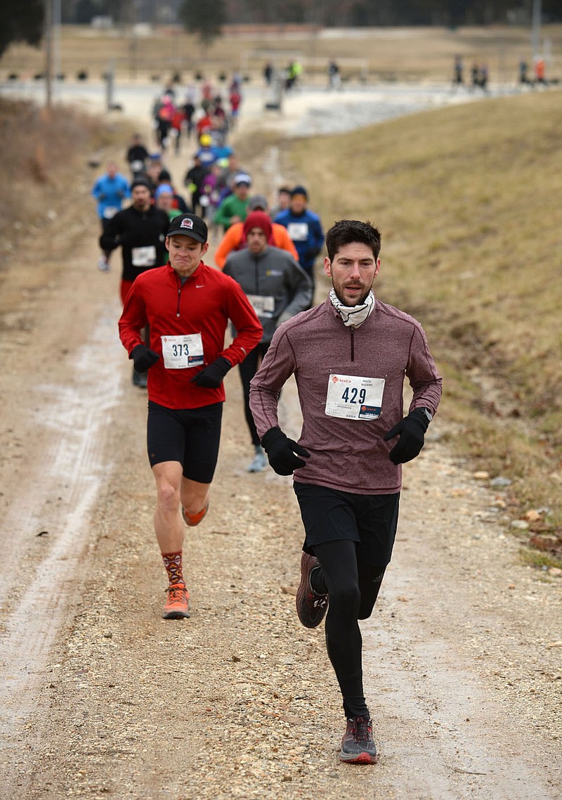 NWA Democrat-Gazette/ANDY SHUPE
Runners begin the fourth annual Frozen Toes 15K trail run Saturday, Feb. 16, 2019, at Kessler Mountain Regional Park in Fayetteville. The race is organized by the Fayetteville Parks and Recreation Department and kicks off the Fayetteville Race Series.