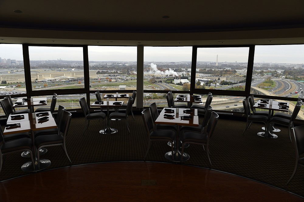 FILE - This Nov. 9, 2018, file photo shows a view of Washington from a revolving restaurant in Crystal City, Va. Stuffed into the new emergency relief package is a morsel that President Donald Trump has long had on the buffet of his economic wish list: restoring full tax breaks for restaurant business meals. (AP Photo/Susan Walsh, File)