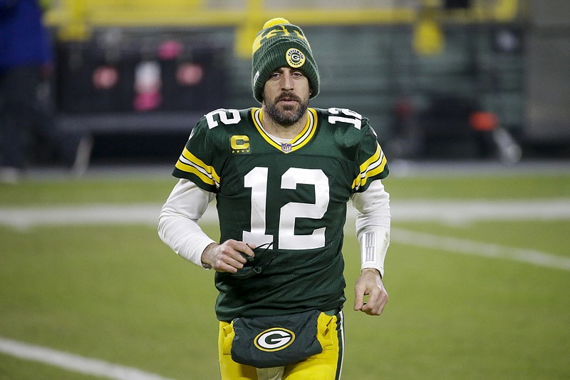 Green Bay Packers' Aaron Rodgers runs off the field after an NFL football game against the Carolina Panthers Saturday, Dec. 19, 2020, in Green Bay, Wis. 
(AP Photo/Mike Roemer)