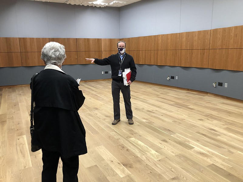 David Johnson, executive director of the Fayetteville Public Library, speaks Monday, Dec. 21, 2020, to board member Martha Sutherland in the library expansion's recording studio. The expanded building has a target date to open Jan. 19. (NWA Democrat-Gazette/Stacy Ryburn) story.lead_photo.caption
