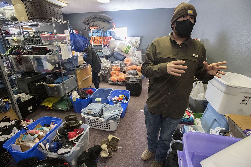 Wyatt Muncy, day center director for 7 Hills Homeless Center, talks Tuesday about the center’s temporary move to the building owned by St. James Missionary Baptist Church on Willow Avenue in Fayetteville. 7 Hills made the move during winter to have more space for clients and staff during the covid-19 pandemic. (NWA Democrat-Gazette/J.T. Wampler)