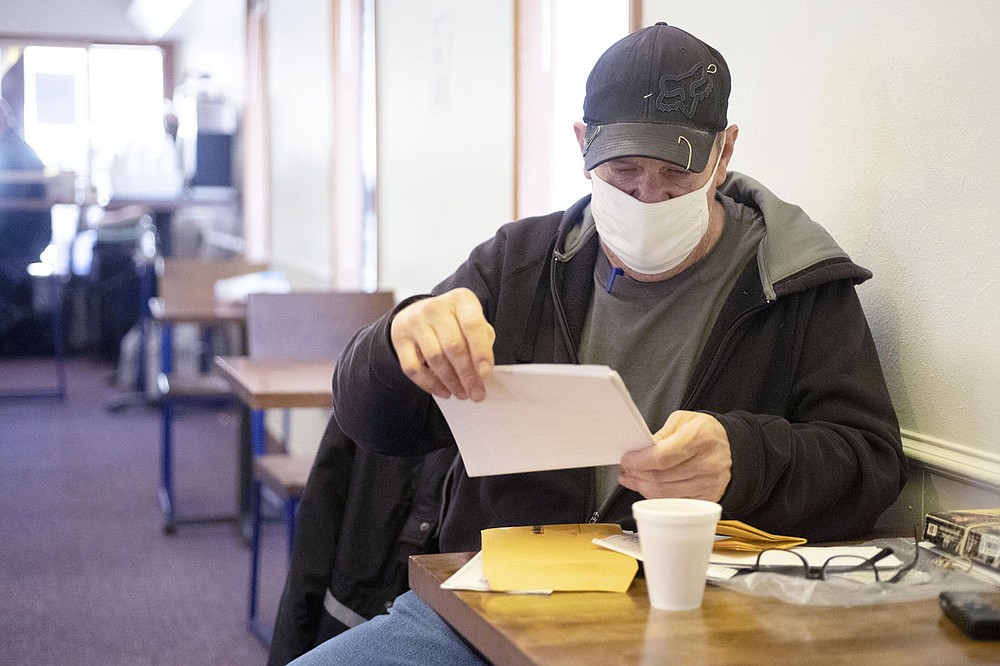 Richard Graham sits Tuesday at the 7 Hills day center operation. (NWA Democrat-Gazette/J.T. Wampler)