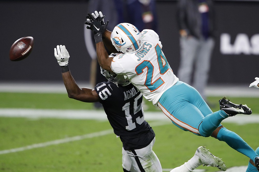 Miami Dolphins running back Myles Gaskin (37) runs past Raiders cornerback  Trayvon Mullen (27) …