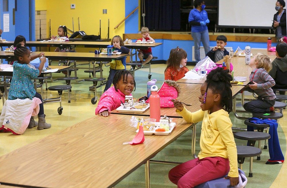 Kindergarten students eat their lunch Dec. 11 while socially distanced in the lunchroom at Gibbs Magnet Elementary School in Little Rock.
Check out nwaonline.com/201228Daily/ and nwadg.com/photos for a photo gallery.
(Arkansas Democrat-Gazette/Thomas Metthe)