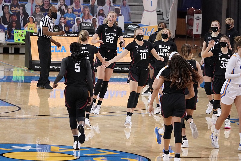 Stanford players celebrate during a timeout as they jump ahead of UCLA during the second half of an NCAA college basketball game Monday, Dec. 21, 2020, in Los Angeles. (AP Photo/Marcio Jose Sanchez)