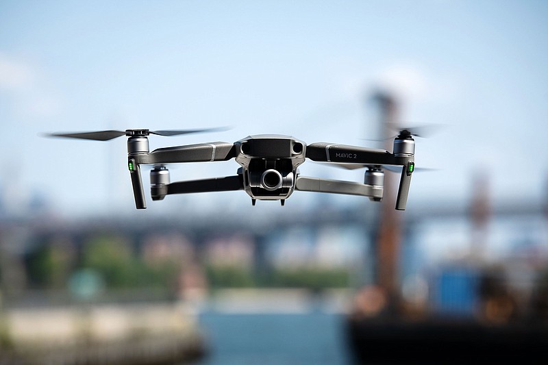 A SZ DJI Technology Co. Mavic 2 Zoom drone flies over the Brooklyn Navy Yard in the Brooklyn Borough of New York on Aug. 23, 2018. MUST CREDIT: Bloomberg photo by Mark Kauzlarich