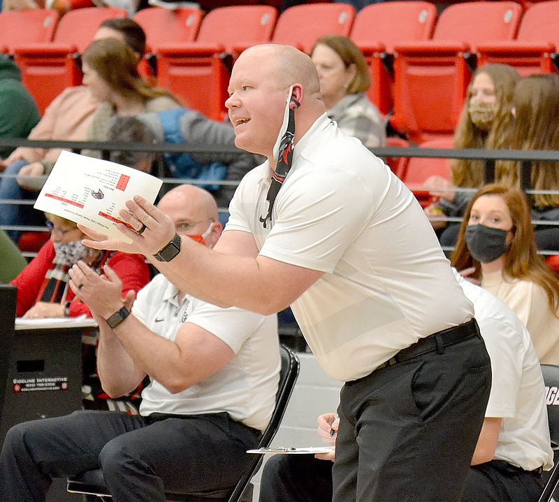 Heath Neal, head coach for the Lady Blackhawks, instructs his team as they battle the Lady Tigers from Prairie Grove in the first game in the new Blackhawk gym Friday, Jan. 8, 2021.