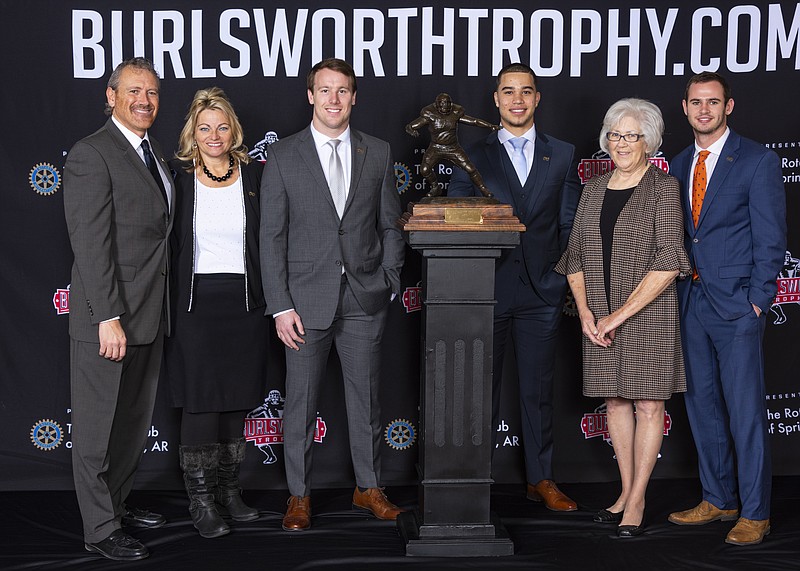 Marty and Vickie Burlsworth (from left), Patrick Laird, Marcus Epps, Barbara Burlsworth and Hunter Renfrow, 2018 Brandon Burlsworth Trophy winner gather at the trophy luncheon that year at the Northwest Arkansas Convention Center in Springdale. (Courtesy photo)