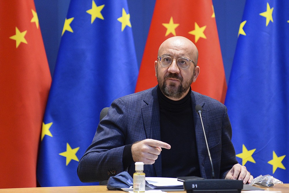 European Council President Charles Michel arrives for an EU-China Leaders' meeting video conference at the European Council headquarters in Brussels, Wednesday, Dec. 30, 2020. The European Union top officials and China president Xi Jinping will conclude Wednesday a business investment deal that will open big opportunities to European companies, with the potential to irk the new American administration. (Johanna Geron, Pool Photo via AP)