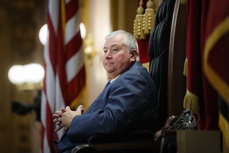 FILE - In this Wednesday, Oct. 30, 2019, file photo, then-Republican Ohio state Rep. Larry Householder, of District 72, sits at the head of a legislative session as Speaker of the House, in Columbus. With their presidential hopes high for fall, some Ohio Democrats, who helped seat Householder, the now-indicted Republican House speaker, and also helped pass the nuclear bailout bill that prosecutors allege Householder delivered as part of a $61 million bribery scheme, have begun shedding campaign contributions tainted by the related federal probe. (AP Photo/John Minchillo, File)