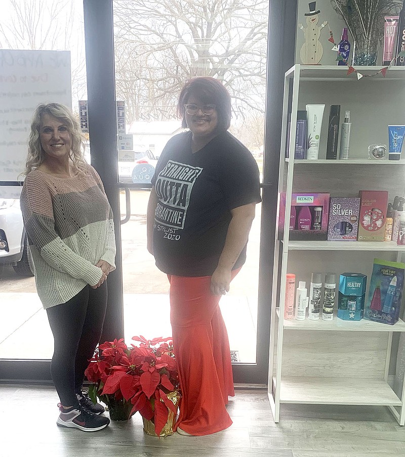 LeighAnn Pinto, owner of Head Hunters Salon, and Cheltzie Muff, stylist, helped the Pea Ridge Lions Club’s fundraising effort by purchasing several poinsettias in December. The fundraiser exceeded previous years' sales.
(Courtesy Photo)