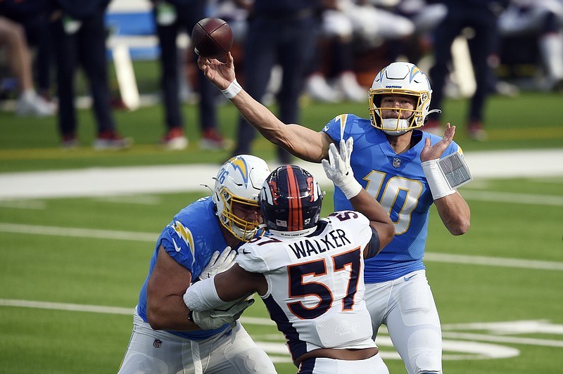Los Angeles Chargers quarterback Justin Herbert (10) throws against the Denver Broncos during the first half of an NFL football game Sunday, Dec. 27, 2020, in Inglewood, Calif. (AP Photo/Kelvin Kuo)