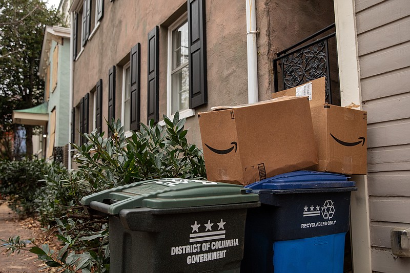 Boxes sit on trash cans in front of a home in Washington D.C.'s Georgetown neighborhood on Nov. 27, 2020. MUST CREDIT: photo for The Washington Post by Amanda Andrade-Rhoades.