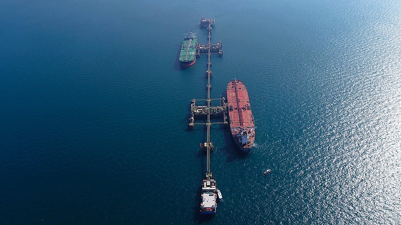 An aerial photo shows oil tankers load crude oil at Iraq's Al-Basra Offshore Terminal in Basra, Iraq, Sunday, Dec. 27, 2020. (AP Photo/Nabil al-Jurani)
