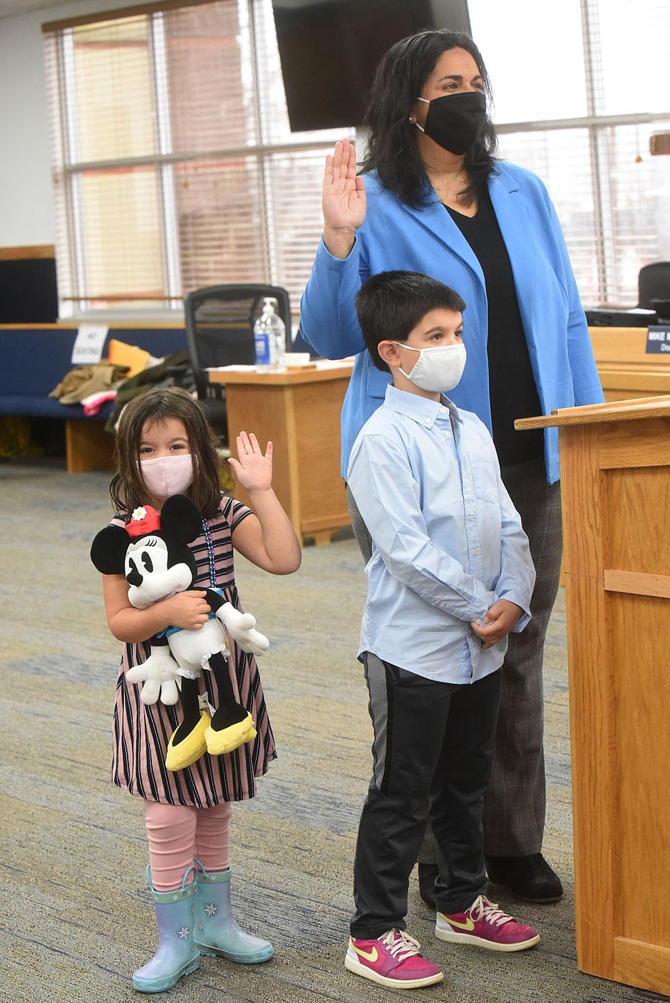 LIKE DAUGHTER LIKE MOM
Gayatri Agnew is sworn in on Friday Jan. 1 2021, New Year's Day, as a member of the Bentonville city council while her daughter, Kamala, 4, raises her right hand as well. Agnew's son, Rohan, 6, also stood with his mom. Benton County Clerk Betsy Harrell swore in Bentonville council members at the county administration building.
(NWA Democrat-Gazette/Flip Putthoff)