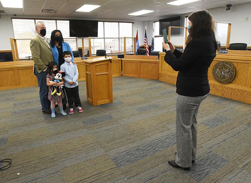 Gayatri Agnew and her family pose for a photo on Friday Jan. 1 2021, New Year's Day, after Agnew was sworn in as a member of the Bentonville City Council. With Agnew is her husband, Ryan Agnew, and their children Kamala, 4, and Rohan, 6. Benton County Clerk Betsy Harrell swore in Bentonville council members at the county administration building.
(NWA Democrat-Gazette/Flip Putthoff)