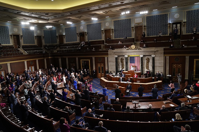 FILE — House Speaker Nancy Pelosi administers the oath to members of the 117th Congress at the U.S. Capitol in Washington in this Sunday, Jan. 3, 2021 file photo. (Erin Scott/Pool via AP)