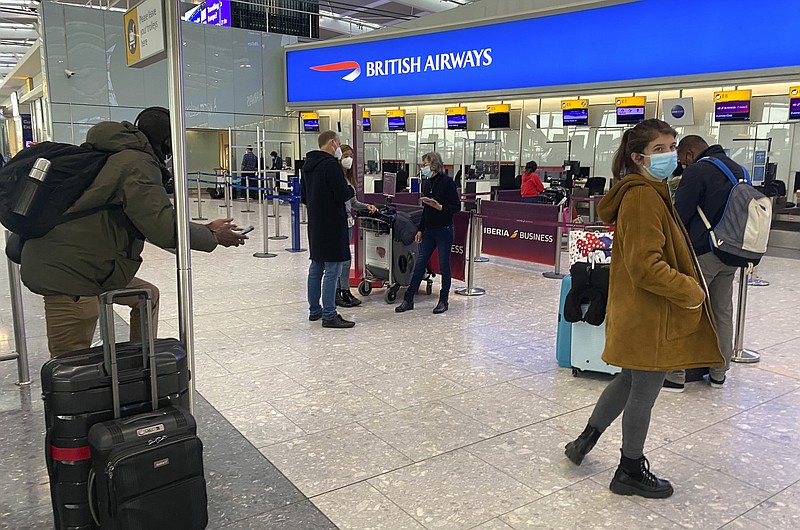 British travelers returning to their homes in Spain wait to speak to airline staff after they were refused entry onto planes, at London's Heathrow airport on Saturday Jan. 2, 2021. Dozens of British residents in Spain were refused travel because airlines refused to take in as proof of residency documents used until the United Kingdom's departure from the European Union at midnight on Dec. 31, 2020. (AP Photo/Max Duncan)