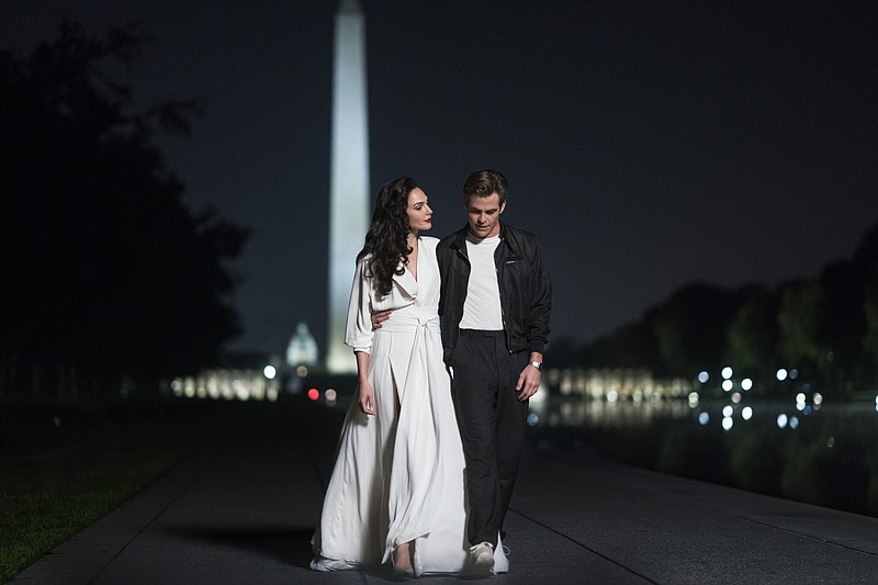 This image released by Warner Bros. Entertainment shows Gal Gadot, left, and Chris Pine in a scene from "Wonder Woman 1984." (Clay Enos/Warner Bros. via AP)