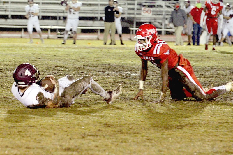 Chris Allred special to the Enterprise-Leader/Lincoln's Kyler Calvin hangs onto the ball after catching a 15-yard pass to convert fourth-and-six during the second quarter of the Wolves' 42-7 playoff loss at McGehee on Nov. 27.