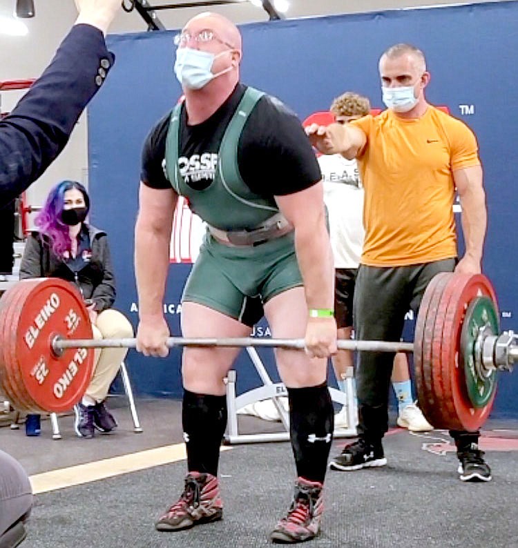 Photo Submitted Michael Spruell (center) is about to receive the signal to lower the weights he has lifted in the Deadlift portion of the meet. Spruell lifted 255 kilograms (562 pounds) during the meet and set a record for -120 Master 1A and 1B Records for Deadlift. story.lead_photo.caption